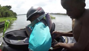 teaching african kid to kayak