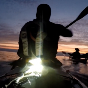 Sea kayaking from darkness to light