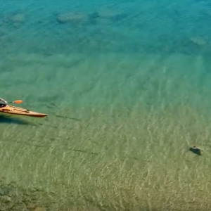Crystal clear water + traditional wooden Kayak !