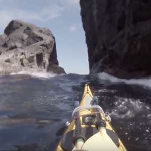 Sea Kayaking through a narrow gap - St Kilda, Isle of Soay