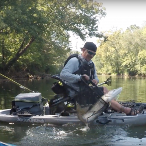 Catching a river monster on a kayak