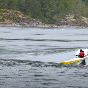 Sea Kayak Surfing Okisollo Tidal Rapids, BC (Canada). Finn Steiner and friends surfing with their Sea Kayaks the magical Okisollo Tidal Rapids, in British Columbia (Canada). The waves form as tidal flows strain through tight channels between islands. The Okisollo Channel is on the north and east side of BC's Quadra Island.
